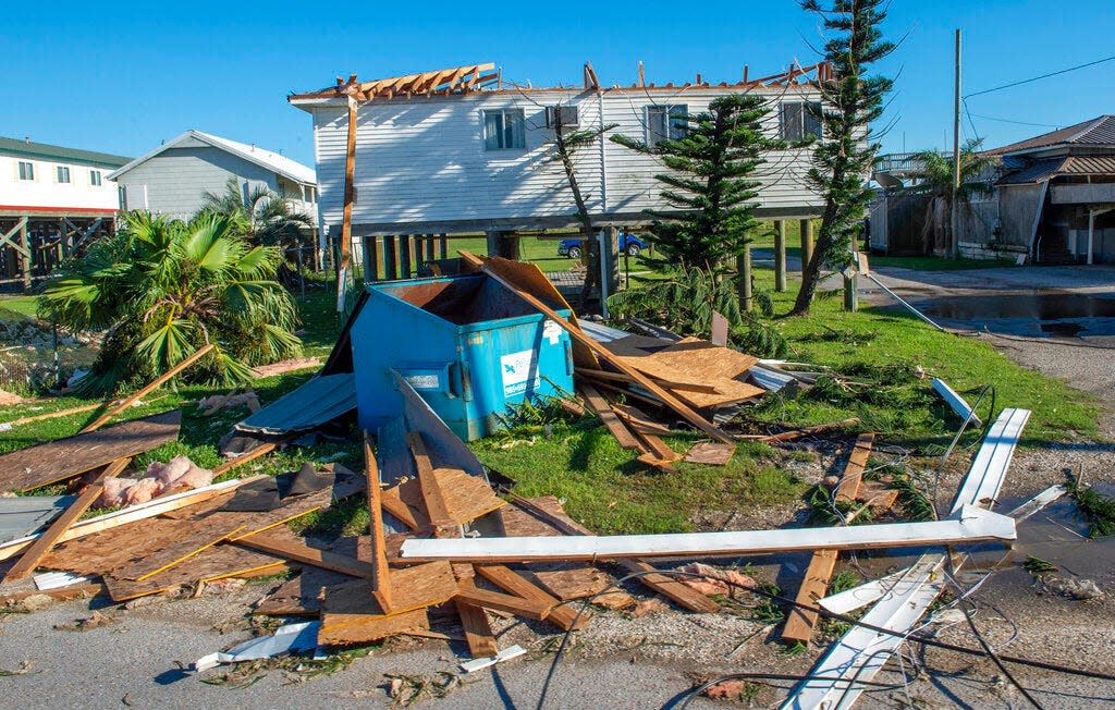 A home missing a roof due to Hurricane Zeta damage is viewed Thursday, Oct. 29, 2020, in Grand Isle, La., as part of Gov. John Bel Edwards flyover of stricken areas in the southeastern part of the state.