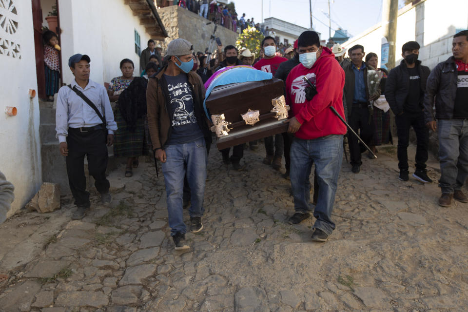 People carry a coffin with the remains of Elfego Miranda Diaz, one of the Guatemalan migrants who was killed near the U.S.-Mexico border in January, at a cemetery in Comitancillo, Guatemala, Saturday, March 13, 2021. / Credit: Moises Castillo / AP