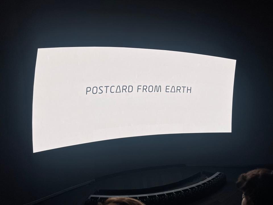 Postcard from Earth title on the screen.