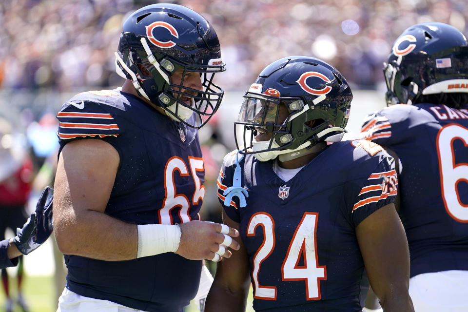 Chicago Bears running back Khalil Herbert (24) celebrates with center <a class="link " href="https://sports.yahoo.com/nfl/players/29290" data-i13n="sec:content-canvas;subsec:anchor_text;elm:context_link" data-ylk="slk:Cody Whitehair;sec:content-canvas;subsec:anchor_text;elm:context_link;itc:0">Cody Whitehair</a> (65) after scoring a touchdown against the Tennessee Titans during the first half of an NFL preseason football game, Saturday, Aug. 12, 2023, in Chicago. (AP Photo/Charles Rex Arbogast) ORG XMIT: AZMY126