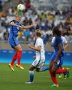 <p>France’s Camille Abily, left, goes for a header during a group G match of the women’s Olympic football tournament between United States and France at the Mineirao stadium in Belo Horizonte, Brazil, Saturday, Aug. 6, 2016. (AP Photo/Eugenio Savio) </p>