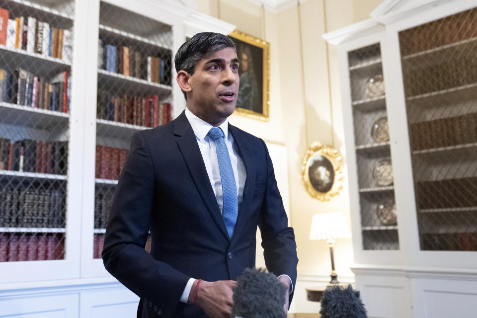 Britain's Prime Minister Rishi Sunak in Downing Street in London Wednesday May 22, 2024, after speaking about the latest inflation figures. Inflation in the U.K. fell sharply to its lowest level in nearly three years in April on the back of big declines in domestic bills, official figures showed Wednesday. (Stefan Rousseau/Pool Photo via AP)