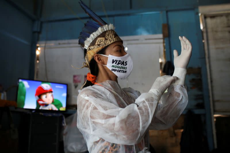 The Wider Image: In the Amazon, an indigenous nurse volunteers in coronavirus fight