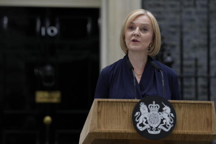 New British Prime Minister Liz Truss makes an address outside Downing Street in London, Tuesday, Sept. 6, 2022 after returning from Balmoral in Scotland where she was formally appointed by Britain's Queen Elizabeth II. (AP Photo/Kirsty Wigglesworth)