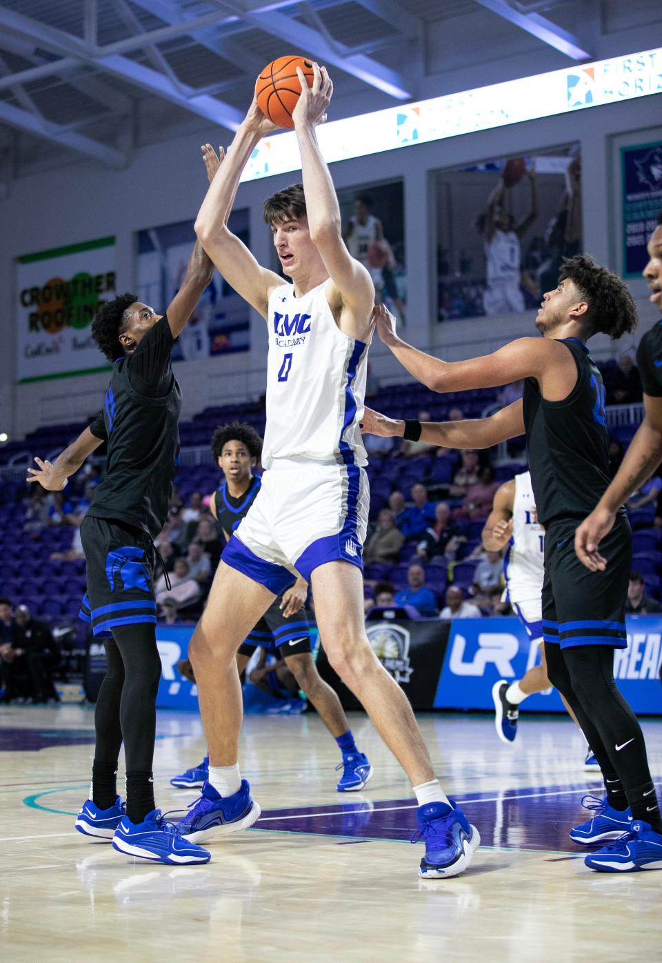 Olivier Rioux of IMG Academy looks for an open teammate in their game against Richmond Heights in the City of Palms Classic on Wednesday, Dec. 20, 2023, at Suncoast Credit Union Arena in Fort Myers.