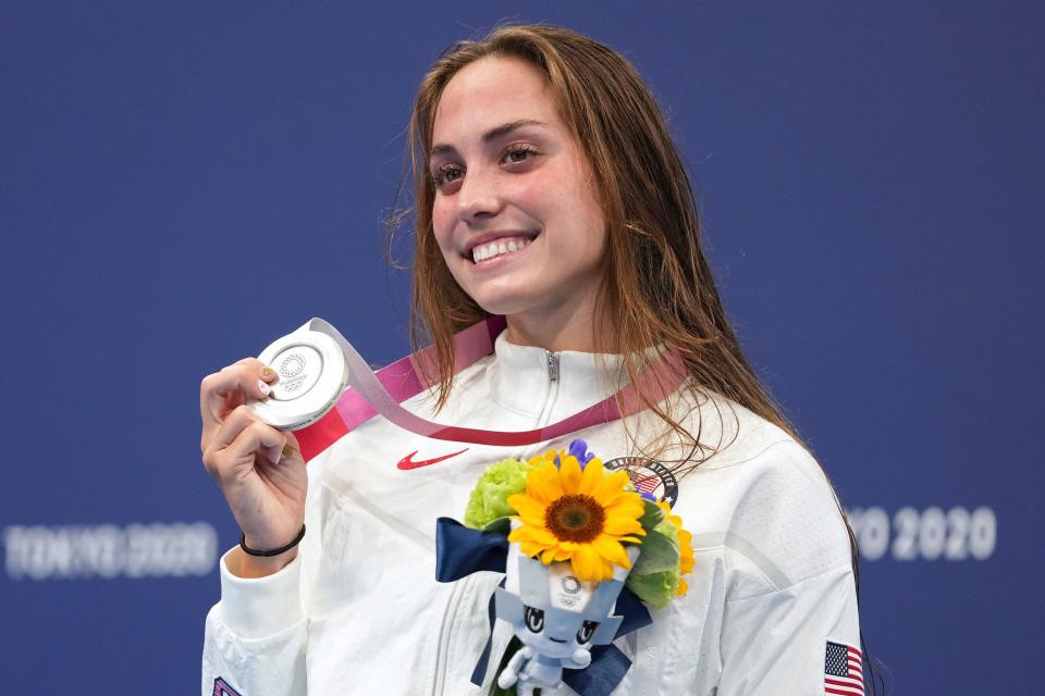 Emma Weyant poses with her silver medal on the podium for the women's 400-meter Individual medley at the 2021 Summer Olympics.