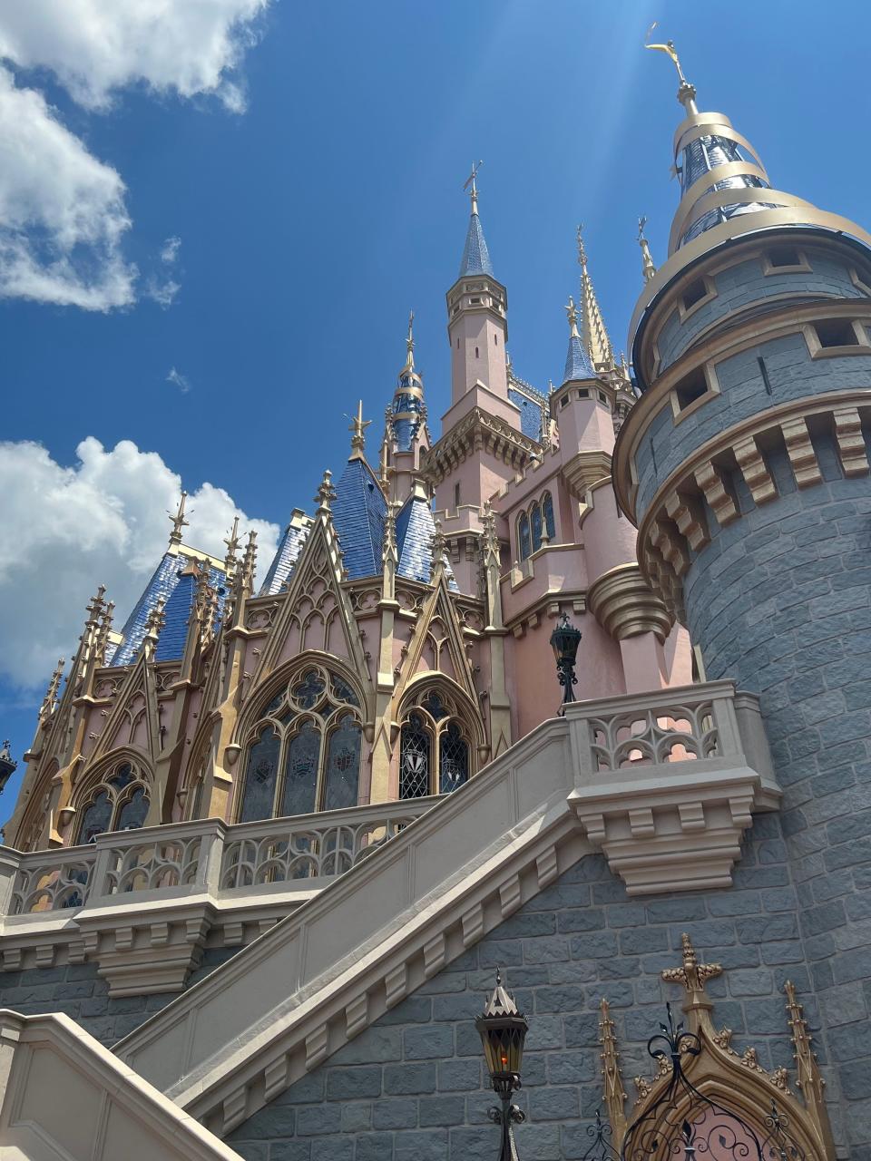 Cinderella Castle is seen up close from Fantasyland in Disney World's Magic Kingdom.