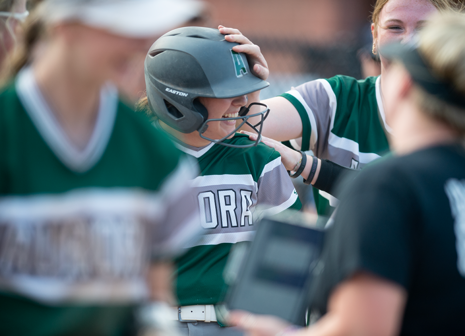 Aurora's Sophie Retton is welcomed at the plate after a home run last year against eventual state champion Tallmadge.