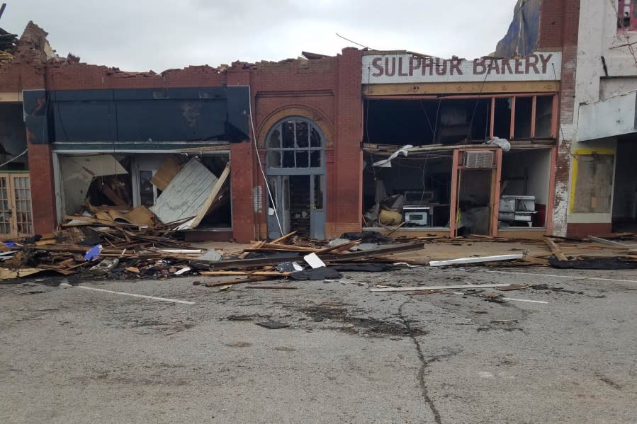 A row of buildings is left damaged by a tornado in Sulphur, Okla., Sunday, April 28, 2024. (AP Photo/Ken Miller)