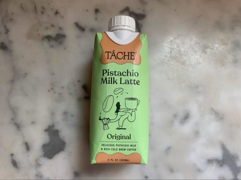 Green carton of pistachio milk latte beverage