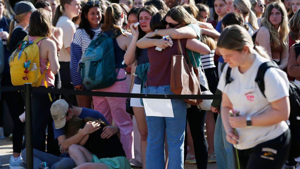 UGA students embrace at a vigil for two students found dead on campus last week. - Joshua L. Jones/Online Athens/USA Today Network