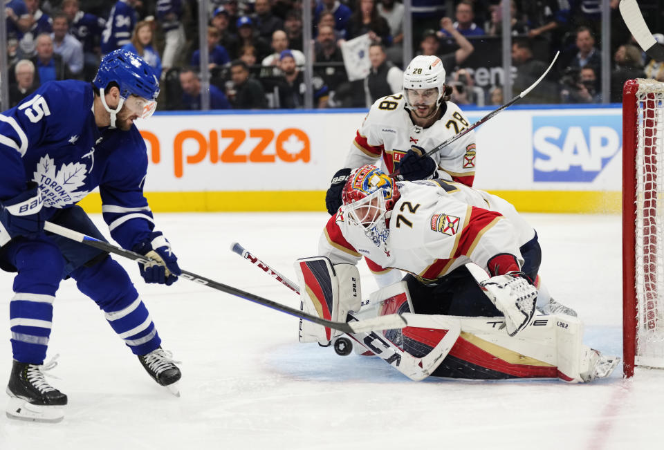 Florida Panthers goaltender Sergei Bobrovsky (72) stops Toronto Maple Leafs forward Alexander Kerfoot (15) as Panthers defenseman Josh Mahura (28) watches during overtime in Game 5 of an NHL hockey Stanley Cup second-round playoff series Friday, May 12, 2023, in Toronto. (Frank Gunn/The Canadian Press via AP)