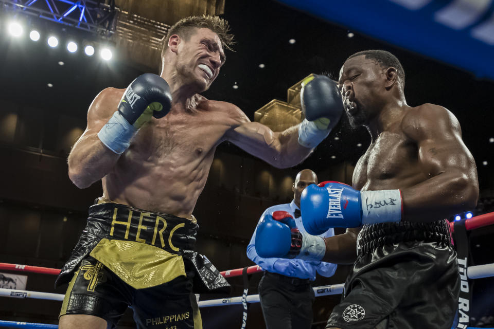 Tyler Howard punches Jamaal Davis during the third round of their middleweight fight at The Theater at MGM National Harbor on July 19, 2019 in Oxon Hill, Maryland. (Photo by Scott Taetsch/Getty Images)