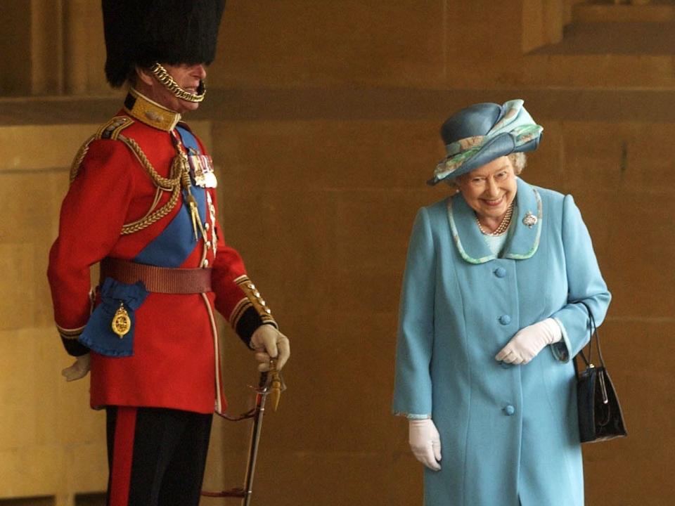 Queen Elizabeth giggles with Prince Philip at a 2003 event at Windsor Castle.