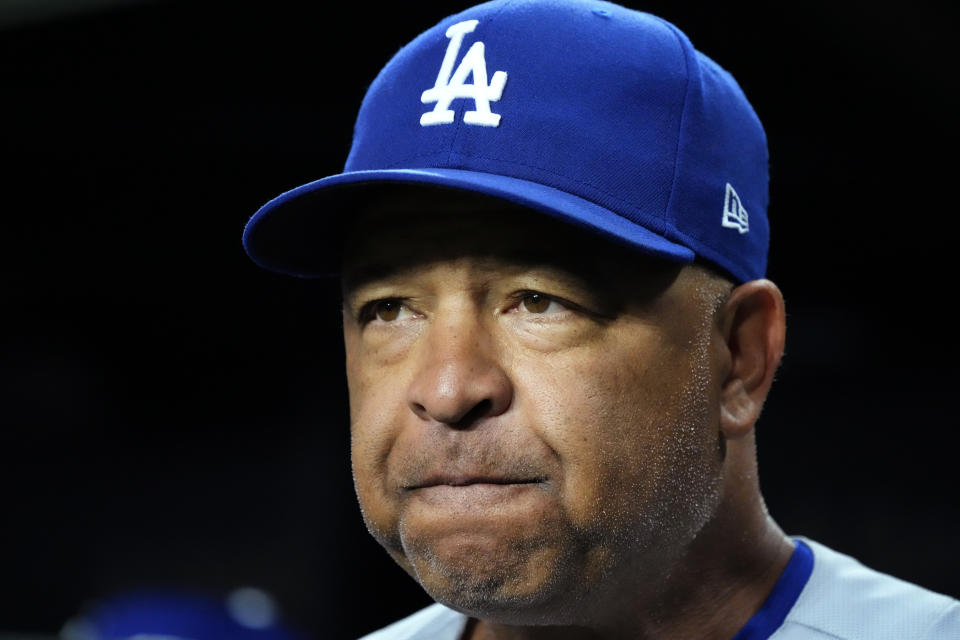 Los Angeles Dodgers manager Dave Roberts looks to the field before the team's baseball game against the Chicago Cubs in Chicago, Thursday, April 20, 2023. (AP Photo/Nam Y. Huh)