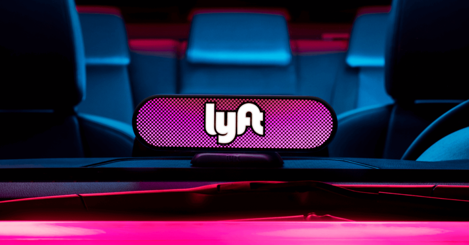 A Lyft beacon in a ridesharing car.