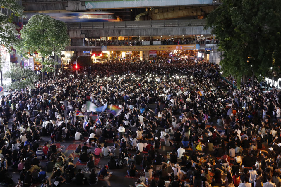 CORRECTS DATE Pro-democracy demonstrators march to the German Embassy in central Bangkok, Thailand, Sunday, Oct. 25, 2020. As lawmakers debated in a special session in Parliament that was called to address political tensions, student-led rallies were set to continue with a march through central Bangkok on Monday evening to the German Embassy, apparently to bring attention to the time King Maha Vajiralongkorn spends in Germany. (AP Photo/Gemunu Amarasinghe)