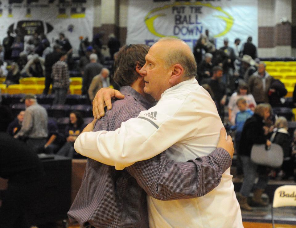 Clyde coach Marc Case, right, hugs Merkel coach B.C. Lee following the Badgers' 42-33 win Jan. 11, 2019. Merkel won this year's meeting, escaping with a 41-40 victory.