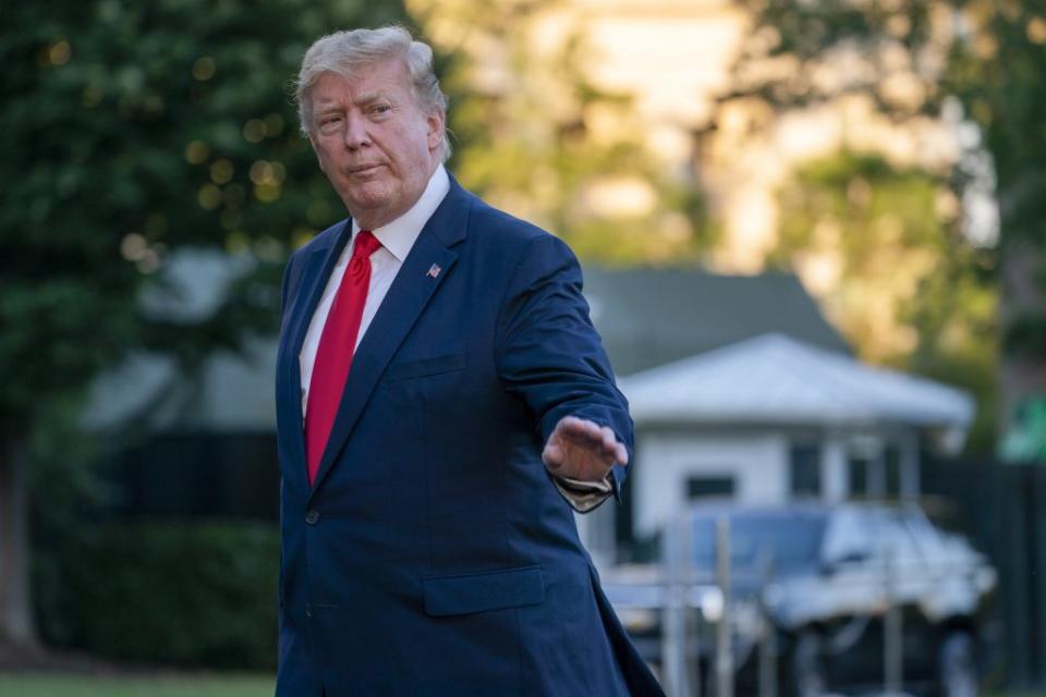 U.S. President Donald Trump waves as he walks off Marine One at the White House after spending the weekend at the G20 Summit and meeting Kim Jong Un, in the DMZ on June 30, 2019 in Washington, DC. Donald Trump met Sunday with Kim Jong Un in the Demilitarized Zone between North and South Korea and became the first U.S. president to step onto North Korean territory. (Photo by Tasos Katopodis/Getty Images)