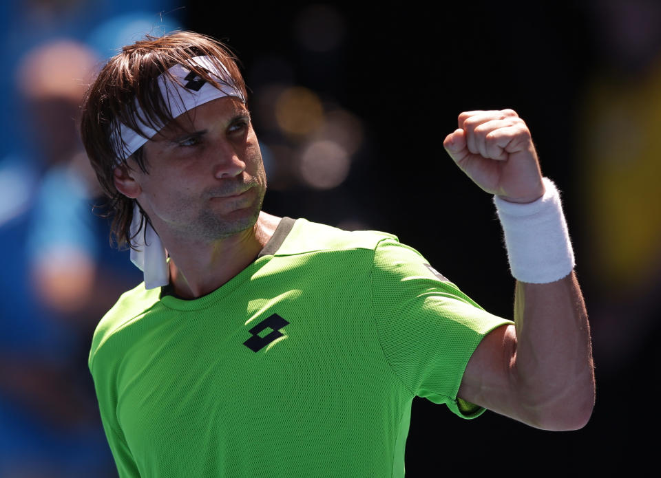 David Ferrer of Spain celebrates after winning over Jeremy Chardy of France during their third round match at the Australian Open tennis championship in Melbourne, Australia, Friday, Jan. 17, 2014.(AP Photo/Aaron Favila)