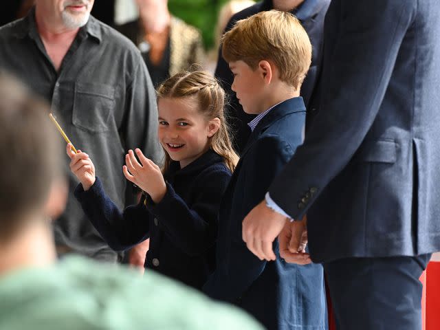 <p>Ashley Crowden - WPA Pool/Getty</p> Princess Charlotte conducting an orchestra in Cardiff, Wales in June 2022