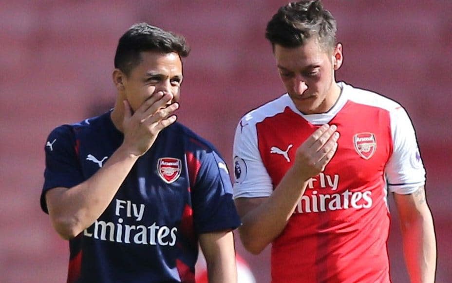 Alexis Sanchez and Mesut Ozil are yet to sign new deals - Rex Features