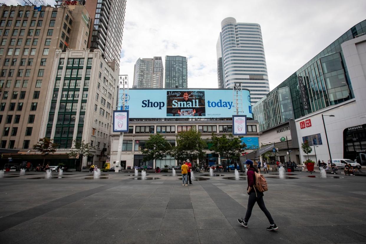 People walk through Toronto’s Yonge-Dundas Square. City Council voted Thursday night to rename the square Sankofa Square. (Evan Mitsui/CBC - image credit)