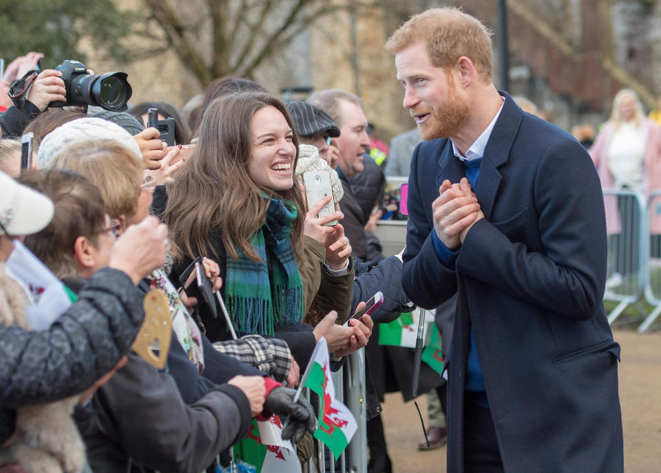 Prince Harry works the crowd. (Photo: Neil Mockford via Getty Images)