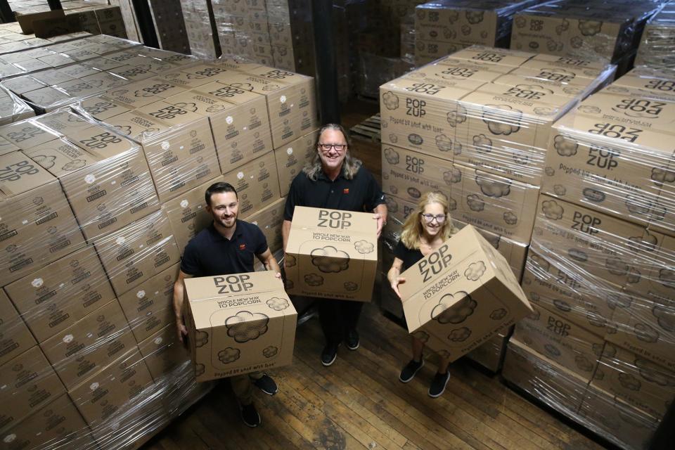 Popzup Popcorn's family leadership team of Nolan Lapham and his parents Marty and Julie are seen in their new home in Somersworth Thursday,. Oct. 5, 2023.