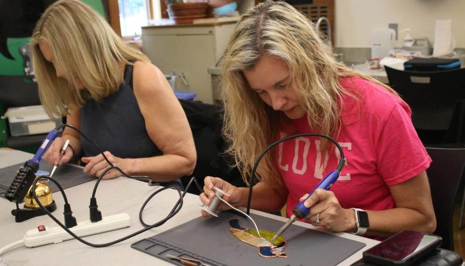 Lee’s Summit resident Erika Jump works on soldering during a stained glass class at the Overland Park Arboretum.