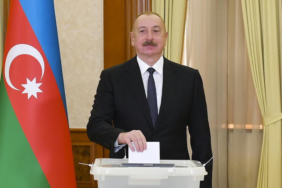 Azerbaijan President Ilham Aliyev casts his ballot during presidential election at a polling station in Khankendi, Karabakh region, Azerbaijan, Wednesday, Feb. 7, 2024. Azerbaijanis are voting Wednesday in an election almost certain to see incumbent President Ilham Aliyev chosen to serve another seven-year term. (Vugar Amrullaev/Azerbaijan State News Agency AZERTAC via AP)