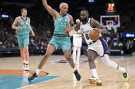 Los Angeles Lakers' LeBron James (6) drives against San Antonio Spurs' Jeremy Sochan during the second half of an NBA basketball game, Friday, Nov. 25, 2022, in San Antonio. (AP Photo/Darren Abate)