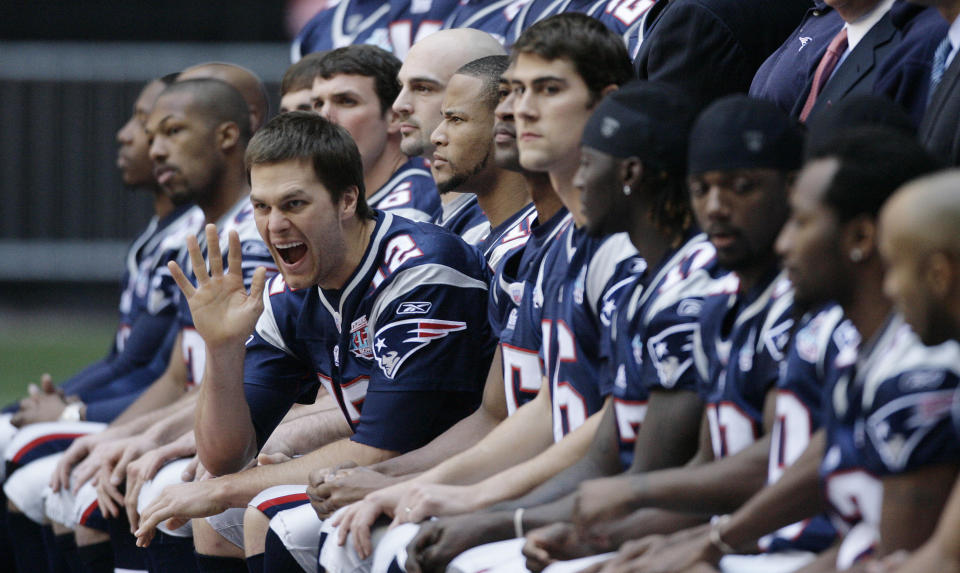 FILE - New England Patriots quarterback Tom Brady waves during the team's picture at the walk through at University of Phoenix Stadium on Saturday, Feb. 2, 2008, in Glendale, Ariz. Tom Brady has retired after winning seven Super Bowls and setting numerous passing records in an unprecedented 22-year-career. He made the announcement, Tuesday, Feb. 1, 2022, in a long post on Instagram. (AP Photo/Stephan Savoia, File)