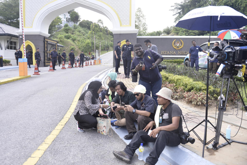 Members of the media gather in front of Istana Negara February 26, 2020. — Picture by Miera Zulyana