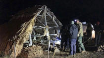 In this photo provided by Pi'ikea Keawekane-Stafford, state and county officials remove Native Hawaiian structures from Mauna Kea, Thursday, June 20, 2019. After years of protests and legal battles, Hawaii officials announced Thursday that a massive telescope which will allow scientists to peer into the most distant reaches of our early universe will be built on a volcano that some consider sacred. The state has issued a "notice to proceed" for the Thirty Meter Telescope project, Gov. David Ige said at a news conference. Ige said four unauthorized structures were removed from the Mauna Kea mountain earlier in the day. (Pi'ikea Keawekane-Stafford via AP)