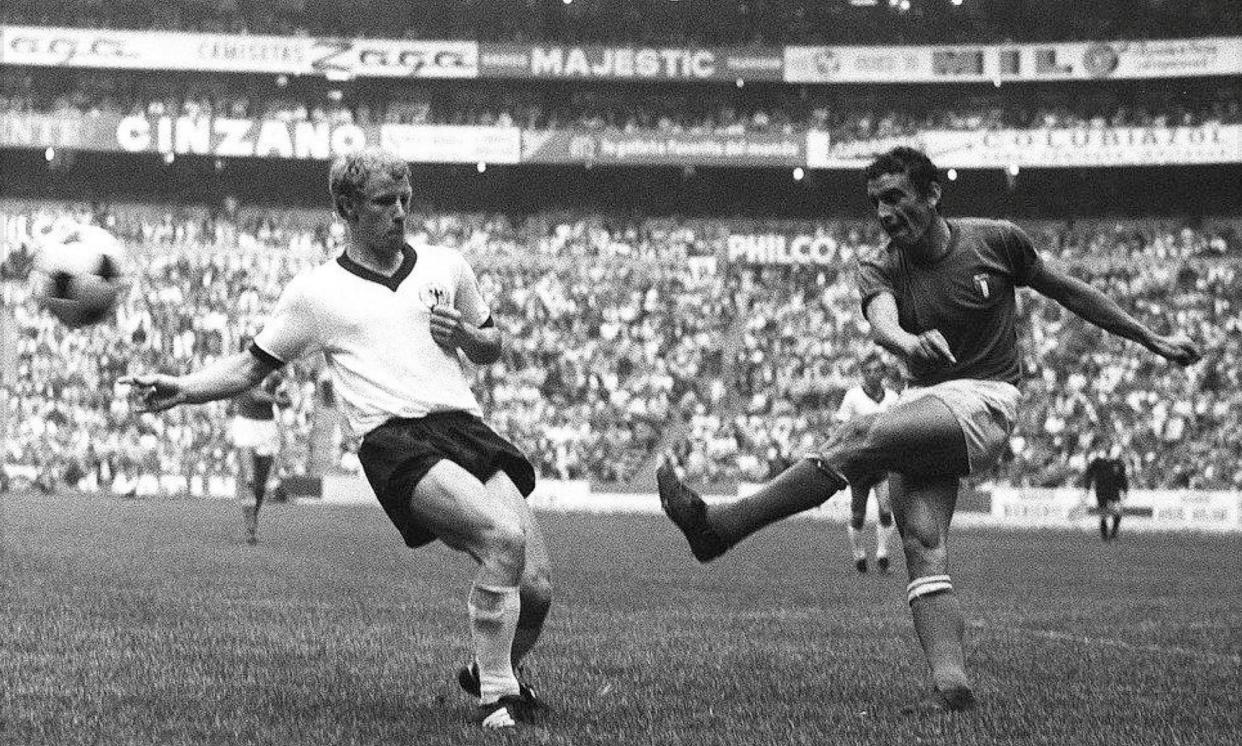 <span>Luigi Riva, right, in a World Cup semi-final in Mexico, 1970. He was one of the scorers when Italy beat Germany 4-3.</span><span>Photograph: Alessandro Sabattini/Getty Images</span>