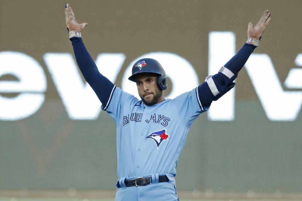 Toronto Blue Jays' George Springer celebrates his leadoff double against the Minnesota Twins during the first inning of a baseball game Friday, May 26, 2023, in Minneapolis. (AP Photo/Bruce Kluckhohn)