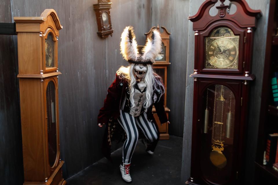 Bunny Binx, played by actor Amy Nichols, jumps out of the clock corner of the haunted house, "mAlice in Wonderland," one of the new haunted houses at Adventureland Park’s Phantom Fall Fest.