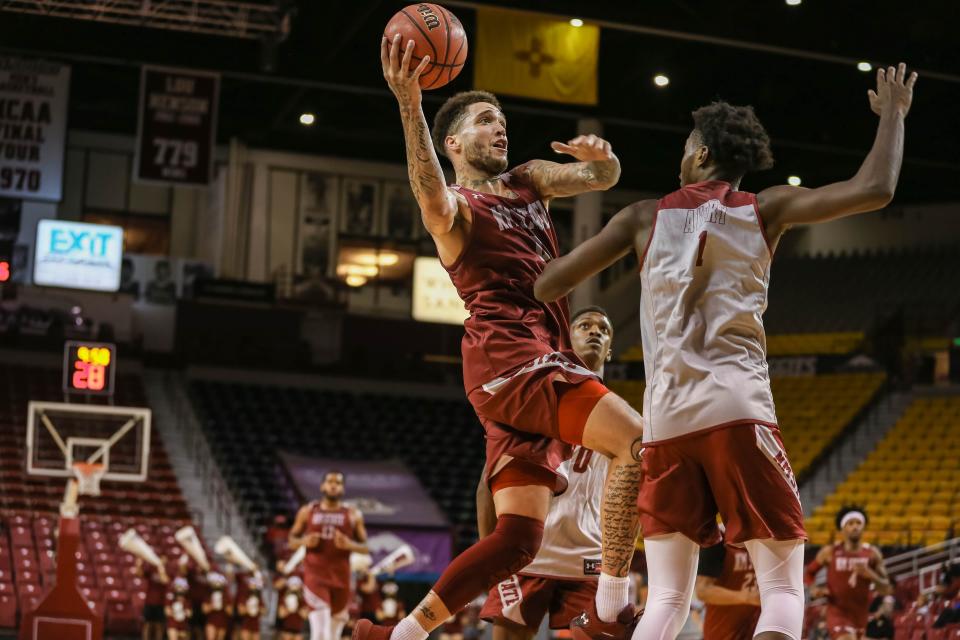 Teddy Allen (0) goes up to shoot at a scrimage game at the Pan American Center at New Mexico State campus in Las Cruces on Tuesday, Oct. 12, 2021.