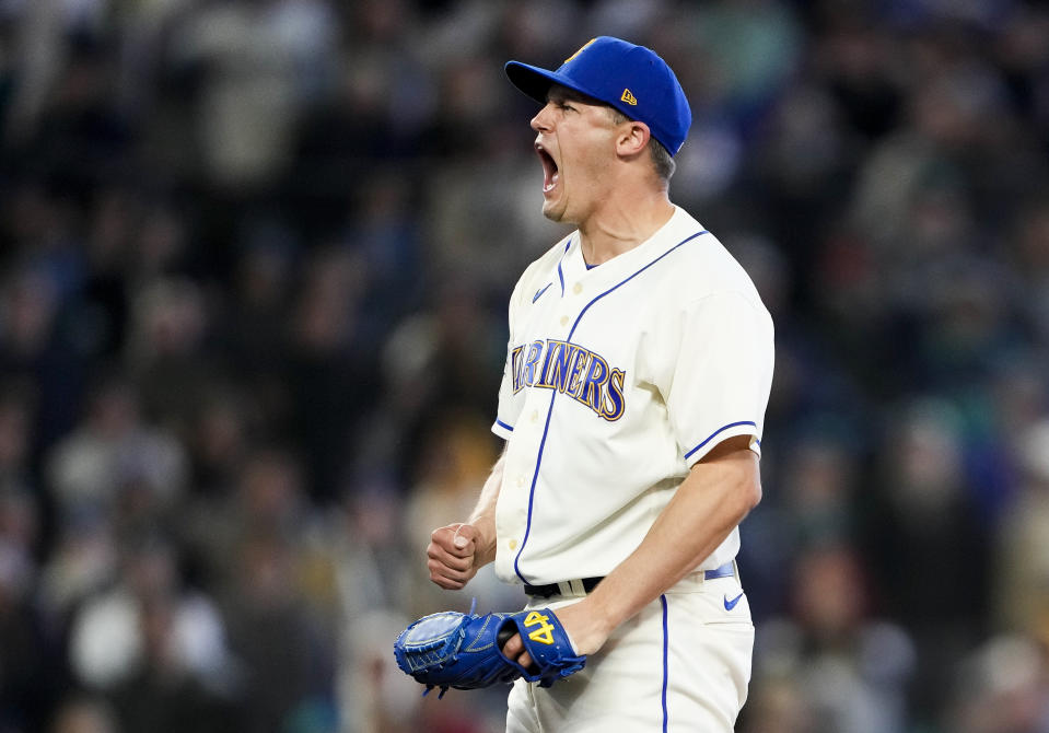 Seattle Mariners relief pitcher Paul Sewald reacts to striking out Colorado Rockies' Charlie Blackmon for the save in a baseball game, Sunday, April 16, 2023, in Seattle. The Mariners won 1-0. (AP Photo/Lindsey Wasson)