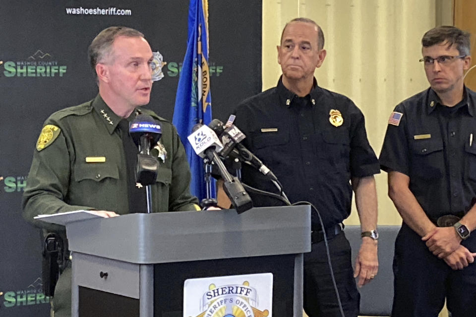 Washoe County Sheriff Darin Balaam, left, answers a reporter's question as fire officials look on during a news conference in Reno, Nev., on Tuesday, Jan. 3, 2023, about the accident that seriously injured actor Jeremy Renner on a private mountain road near Lake Tahoe on New Year's Day. The serious injuries Renner suffered while using a snow tractor to free a snowbound motorist on a private mountain road near Lake Tahoe appear to be a “tragic accident,” the sheriff in Reno said Tuesday. (AP Photo/Scott Sonner)