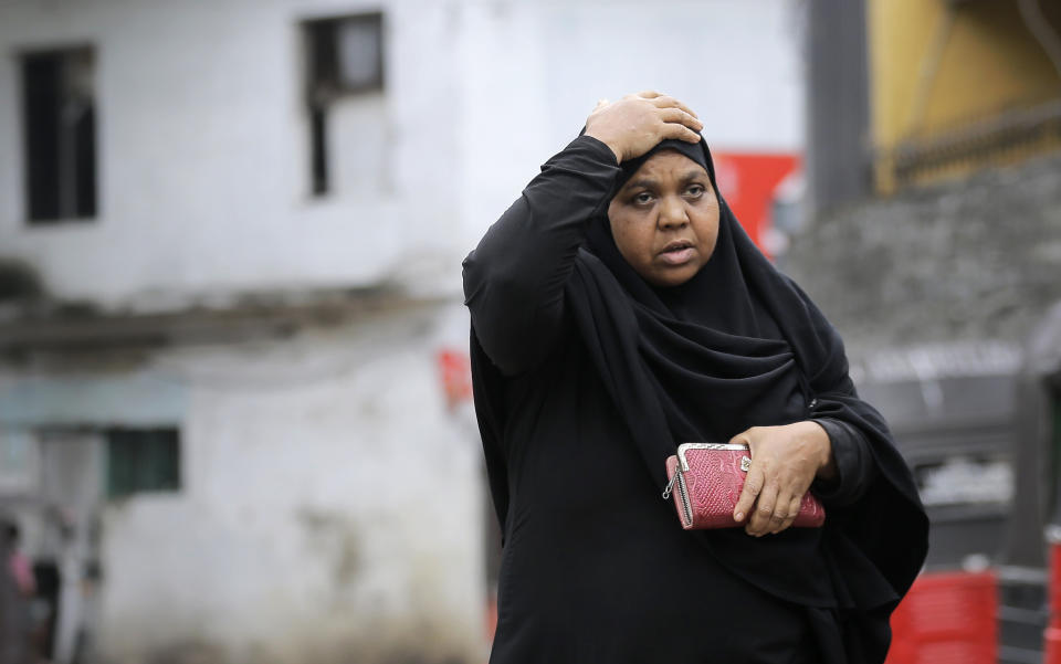 A Sri Lankan Muslim woman walks in a street in Colombo, Sri Lanka, Tuesday, Aug. 27, 2019. A Sri Lankan Muslim woman walks in a street in Colombo, Sri Lanka, Tuesday, Aug. 27, 2019. Islamic clerics in Sri Lanka asked Muslim women on Tuesday to continue to avoid wearing face veils until the government clarifies whether they are once again allowed now that emergency rule has ended four months after a string of suicide bomb attacks. (AP Photo/Eranga Jayawardena)