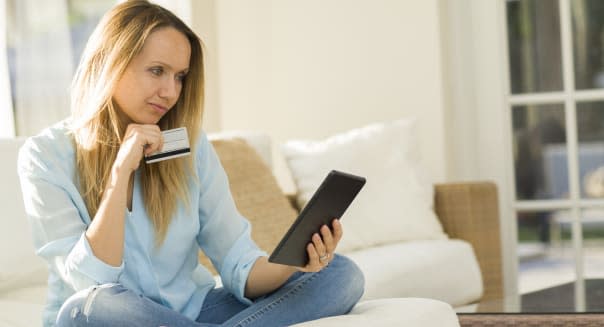 Caucasian woman shopping online with digital tablet