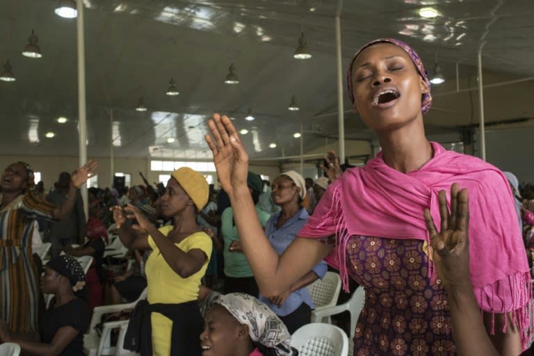 People pray at a "singles summit" held at the Mountain of Fire and Miracles Ministries' its vast Prayer City complex, off the Lagos to Ibadan expressway