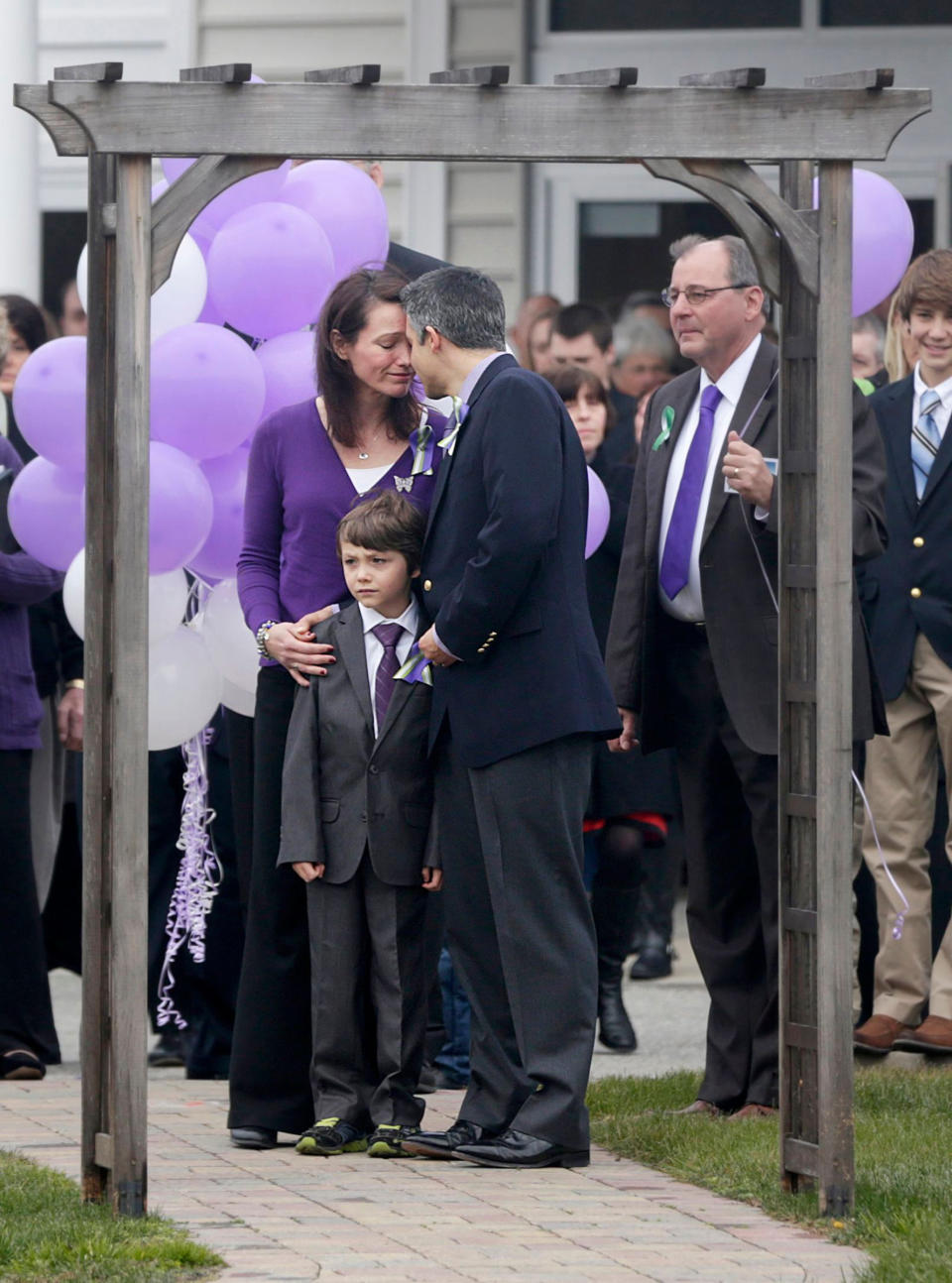 Nicole Hockley and husband Ian Hockley, with Jake between, at the end of a memorial service for Dylan Hockley in Bethel, Conn., Dec. 21, 2012.<span class="copyright">Seth Wenig—AP/Shutterstock</span>