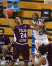 Texas Southern forward John Walker III (24) grabs a rebound next to Mount St. Mary's forward Malik Jefferson (42) during the second half of a First Four game in the NCAA men's college basketball tournament Thursday, March 18, 2021, in Bloomington, Ind. (AP Photo/Doug McSchooler)