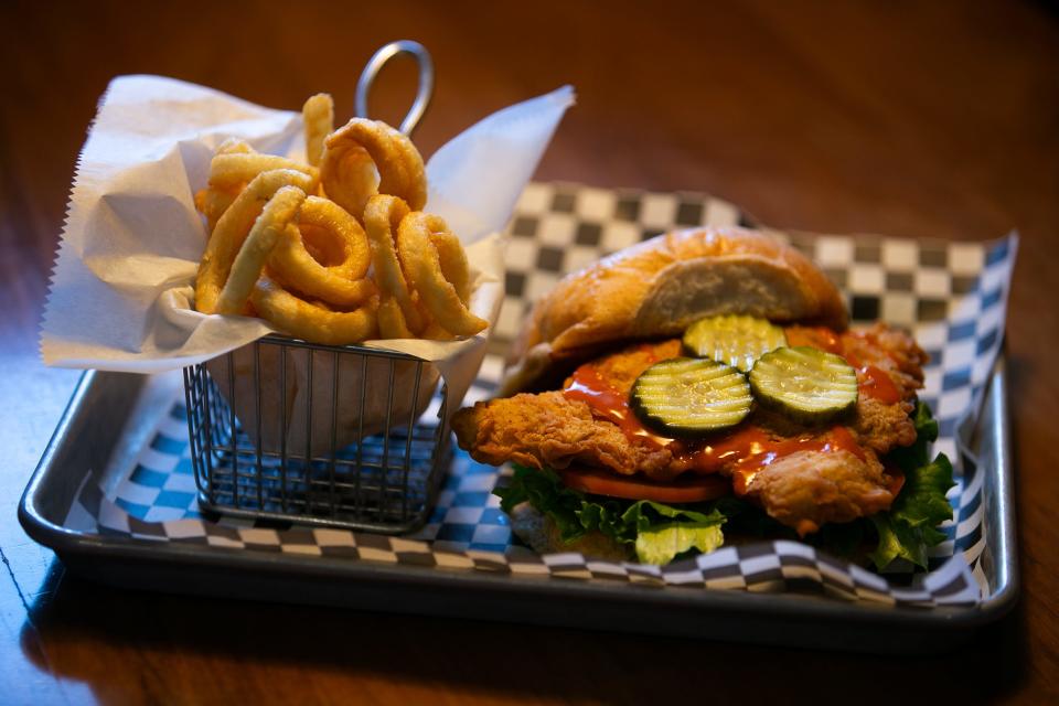 The Buffalo Chicken Sandwich, which include tomatoes, lettuce, pickles and buffalo sauce, is on display at Wallbangers Wednesday, Jan. 3, 2024.