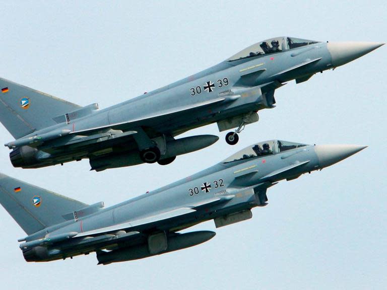 A pilot has been killed after two Eurofighter jets collided mid-air in northern Germany.The jets were not armed but were taking part in an air combat mission with a third Eurofighter plane, the German air force said.Both pilots ejected successfully and one was found alive in a forest, police officers said.But officers told broadcaster n-tv that the other pilot had been killed.The pilot of the third jet observed and reported the collision, the German air force said.“The pilot of the third Eurofighter observed the collision and reported that two parachutes descended to the ground,” a spokesperson said.The planes collided shortly before 2pm on Monday near Lake Mueritz, about 100km north of Berlin.They then crashed near the Laage military base in the eastern state of Mecklenburg-Vorpommern, after the two pilots ejected.Rescue teams found one pilot alive, hanging in the crown of a tree in a forest.A video posted online shortly after the accident showed two plumes of smoke rising from the ground.The Schweriner Volkszeitung newspaper reported that falling wreckage caused forest fires and may also have hit inhabited areas.Firefighters have been deployed to tackle any blazes caused by the accident.Police officers also warned members of the public not to approach the crashed planes, as the wreckage could be dangerous.The Eurofighter jets are made by Airbus, BAE Systems and Leonardo.Additional reporting by agencies