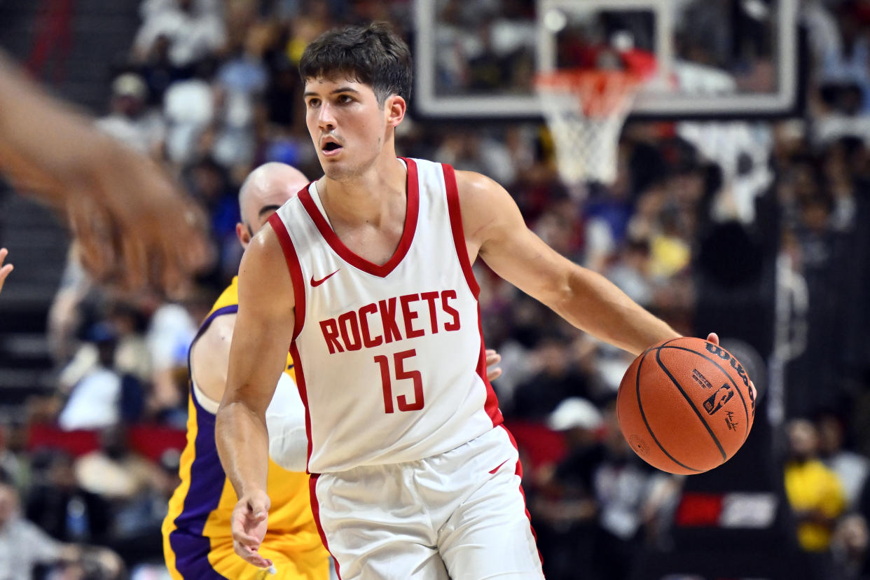 Houston Rockets guard Reed Sheppard (15) drives the ball against the Los Angeles Lakers during the second half of an NBA summer league basketball game Friday, July 12, 2024, in Las Vegas. (AP Photo/David Becker)