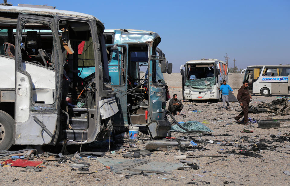 People gather at the site of a blast in Samarra